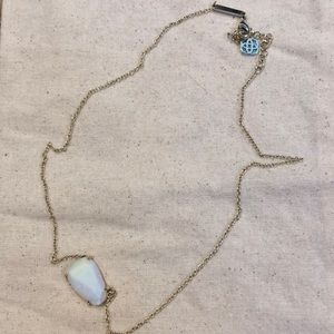 Kendra Scott gold pendant with ivory stone